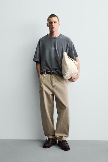 Zara Футболка с эффектом потертости и контрастным принтом