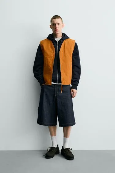 Жилет с эффектом потертости