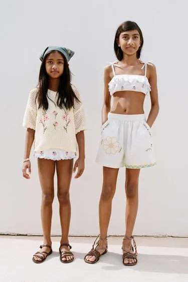 Вышитое трикотажное поло- Заказать в России