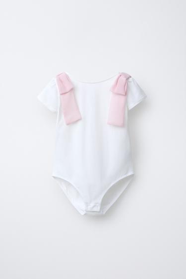 Боди с контрастными бантами- Заказать в России