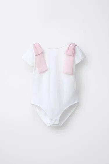 Боди с контрастными бантами- Заказать в России