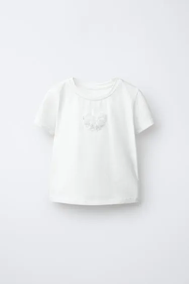 Футболка с бантом и бусинами