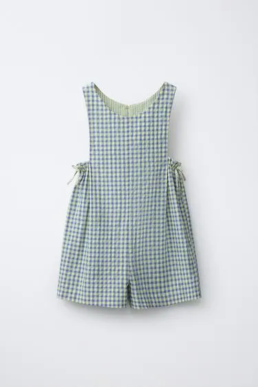 Короткий комбинезон в клетку виши с бантами
