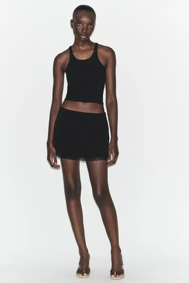 Мини-юбка из эластичной ткани с кружевом- Заказать в России