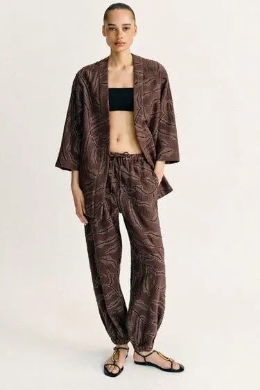 Шаровары из металлизированной ткани с пайетками- Заказать в России