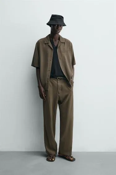 Струящиеся брюки Relaxed Fit- Заказать в России