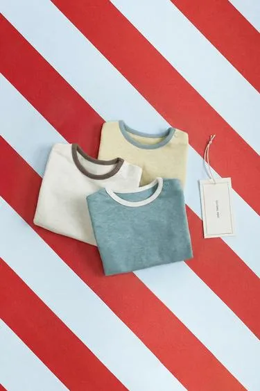 Zara «Timeless» — набор из трех боди с контрастной отделкой