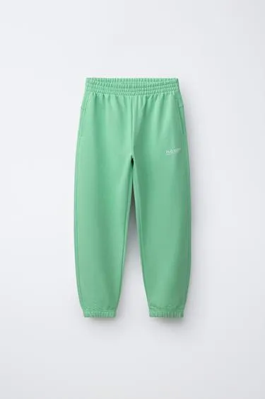 Брюки-джоггеры с надписью