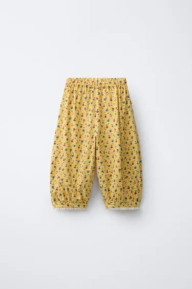 Брюки-бомбашки из льна с цветочным принтом- Заказать в России