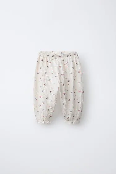 Брюки-джоггеры с цветочным узором- Заказать в России