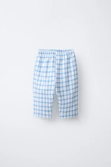 Брюки в клетку с карманами- Заказать в России