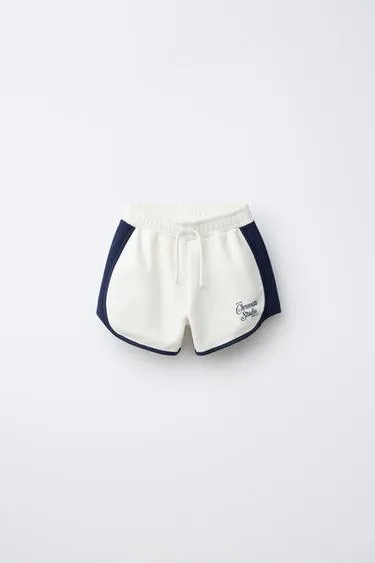 Бермуды с контрастной надписью- Заказать в России