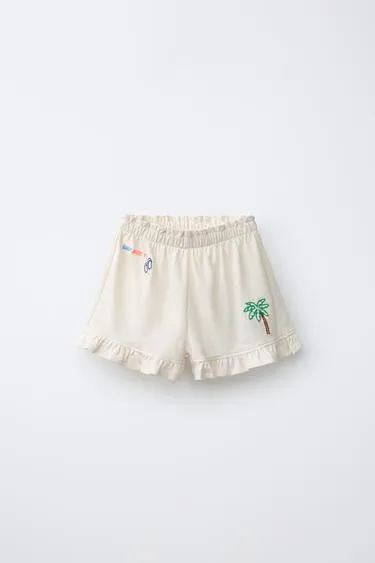 Шорты с воланами и тропическим принтом- Заказать в России