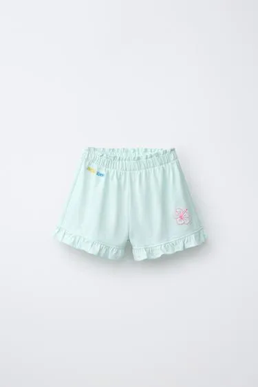 Шорты с воланами и тропическим принтом