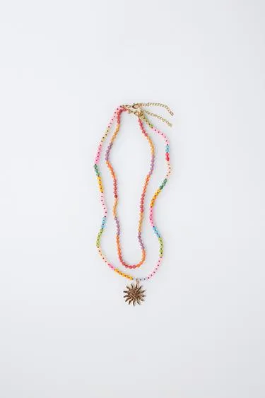 Набор из двух бус и колье с подвеской в виде солнца- Заказать в России