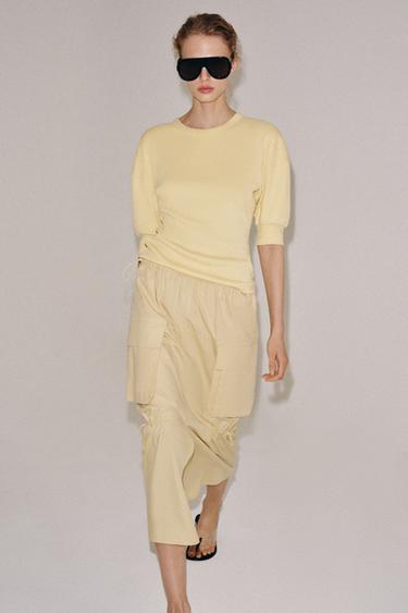 Футболка в рубчик с объемными рукавами- Заказать в России