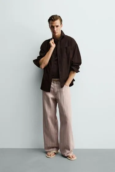 Джинсы  в полоску с принтом