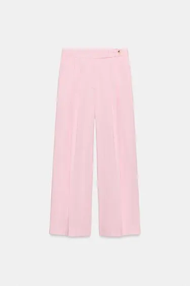 Брюки с широкими штанинами и защипами