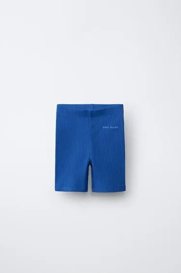 Велосипедные легинсы в рубчик с рельефной надписью