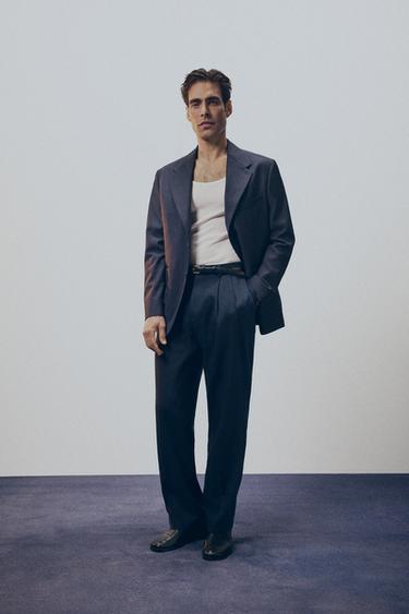 Брюки Relaxed Fit из 100% шерсти с защипами