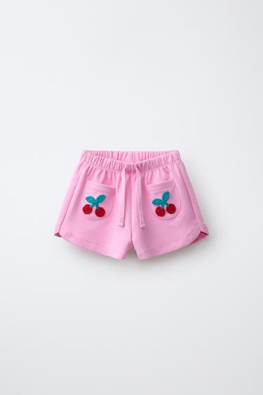 Шорты из трикотажа и кружева кроше с фруктовым декором- Заказать в России