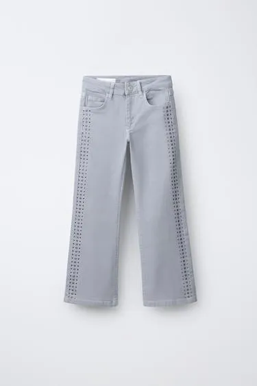Джинсы Bootcut с заклепками- Заказать в России