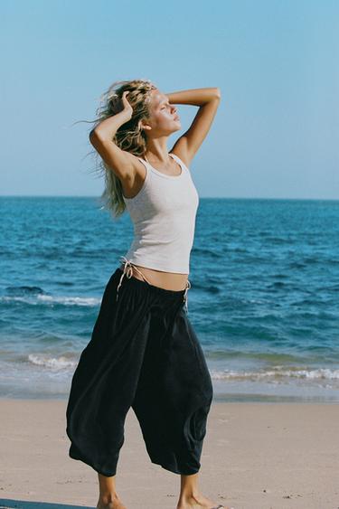 Zara Объемные струящиеся брюки купить с доставкой.