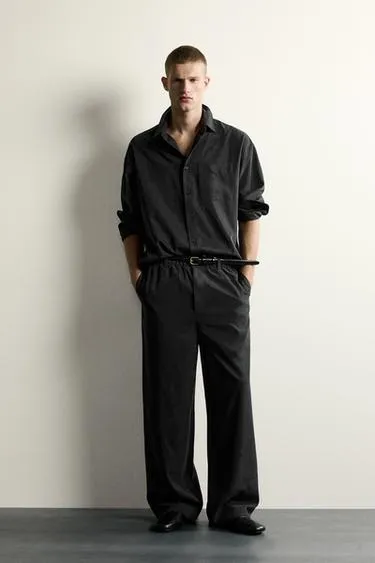 Струящиеся брюки Relaxed Fit- Заказать в России