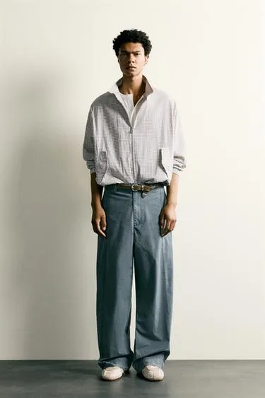 Брюки Relaxed Fit с эффектом потертости и хлястиками- Заказать в России