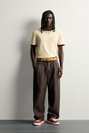 Брюки чинос Relaxed Fit со складками- Заказать в России