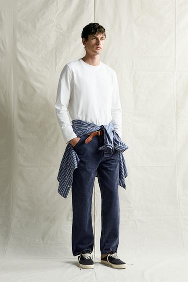 Джинсы Relaxed Fit с эффектом потертости- Заказать в России