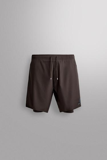 Zara Двухслойные тренировочные шорты купить с доставкой.
