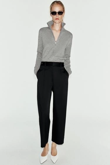 Trousers with waist tabs