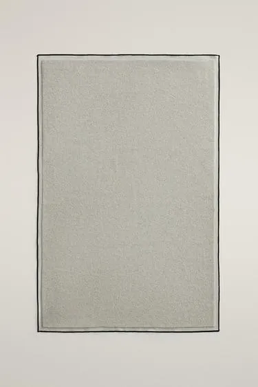 Cotton bath mat with overlock