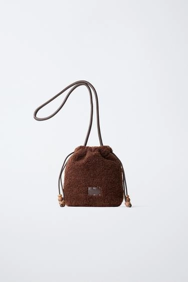 Sheepskin bucket bag with beads