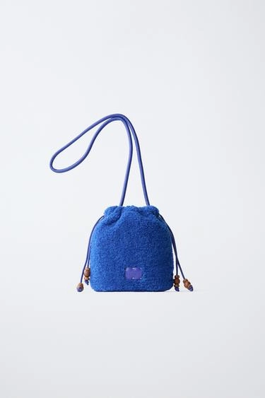 Beaded sheepskin bucket bag