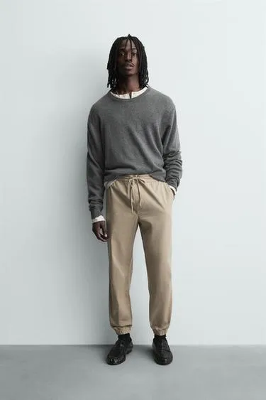 Брюки SLIM FIT с поясом-джоггер- Заказать в России