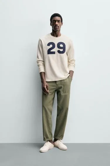 Футболка с широкими рисунками в стиле вафельного трикотажа- Заказать в России