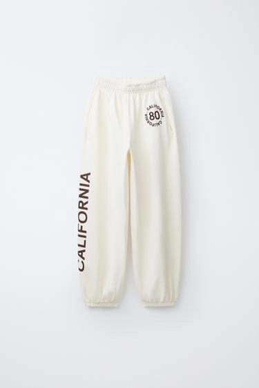 BALLOON PLUSH TROUSERS WITH SLOGAN- Заказать в России