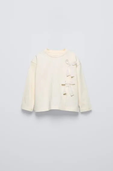 Лонгслив с бантами- Заказать в России