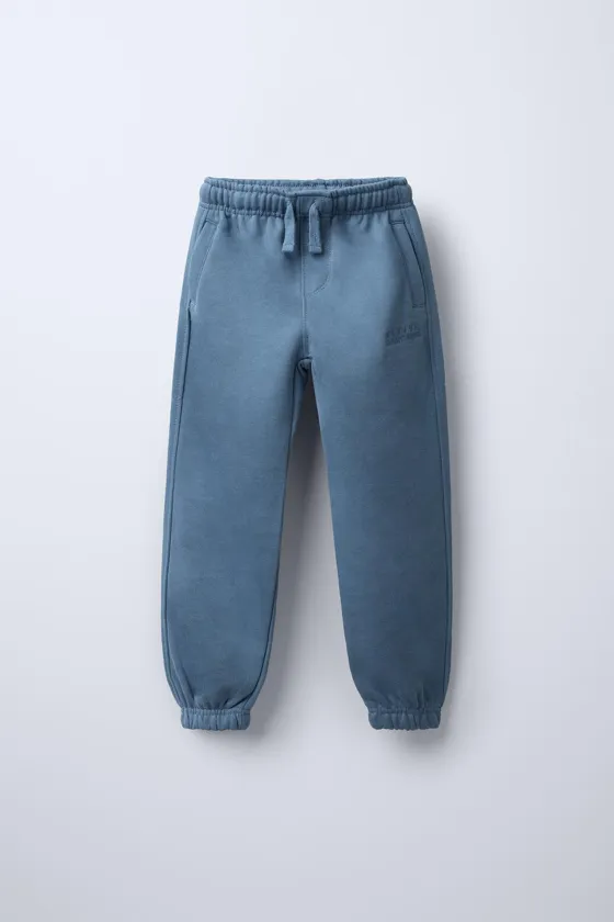 БРЮКИ С ВЫШИТОЙ НАДПИСЬЮ