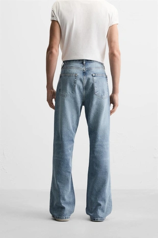 Расклешенные джинсы с разрезами