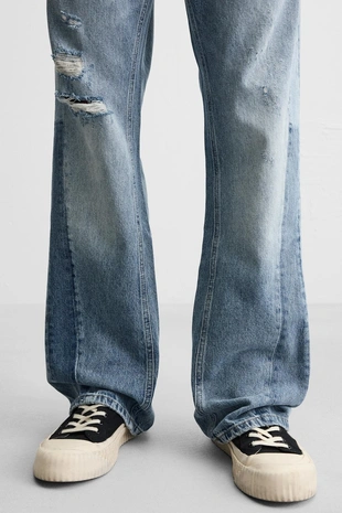 Расклешенные джинсы с разрезами- Заказать в России