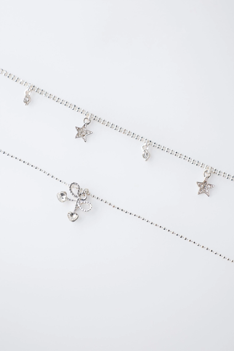 Набор из двух ожерелий со звездами и подвеской в виде вишни