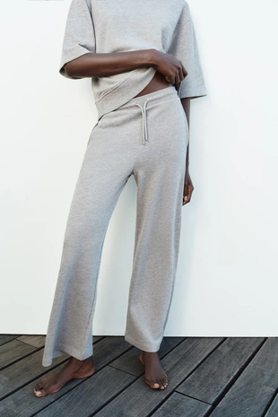 Широкие брюки из ткани с эффектом потертости