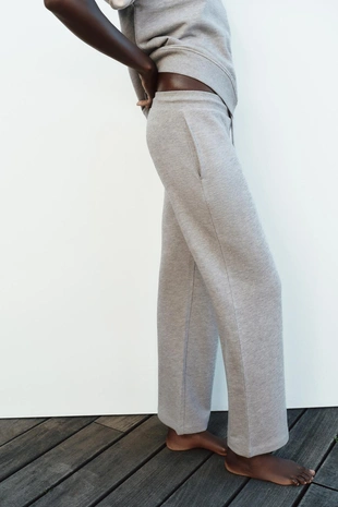 Широкие брюки из ткани с эффектом потертости