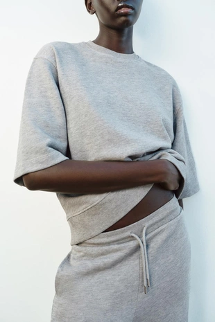 Широкие брюки из ткани с эффектом потертости