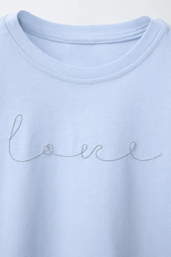 ФУТБОЛКА С ЦВЕТОЧНЫМ ПРИНТОМ И БУСИНАМИ