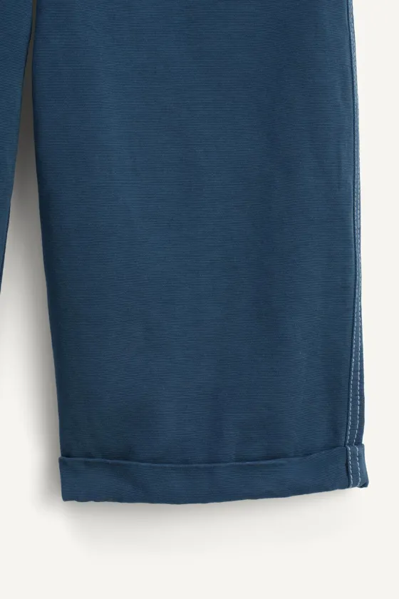 Брюки темно-синие с контрастной строчкой на подгибе limited edition