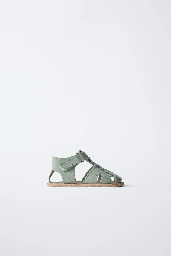 Leather sandals with seahorse